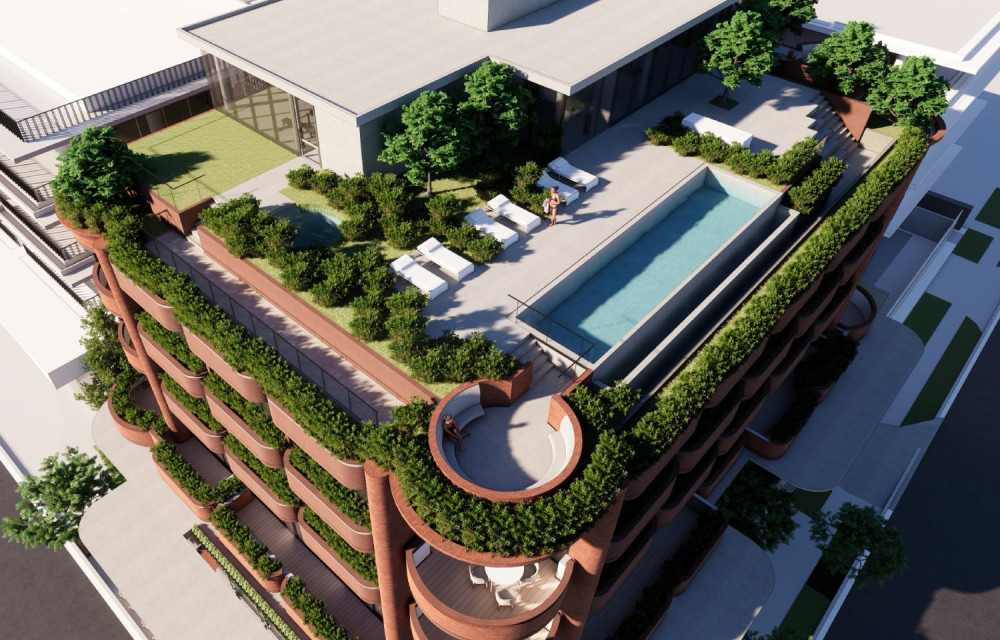 Artist’s impression of a four-storey mixed-use residential building at Hamilton, featuring ground-floor retail frontage, and rooftop recreation area with greenery