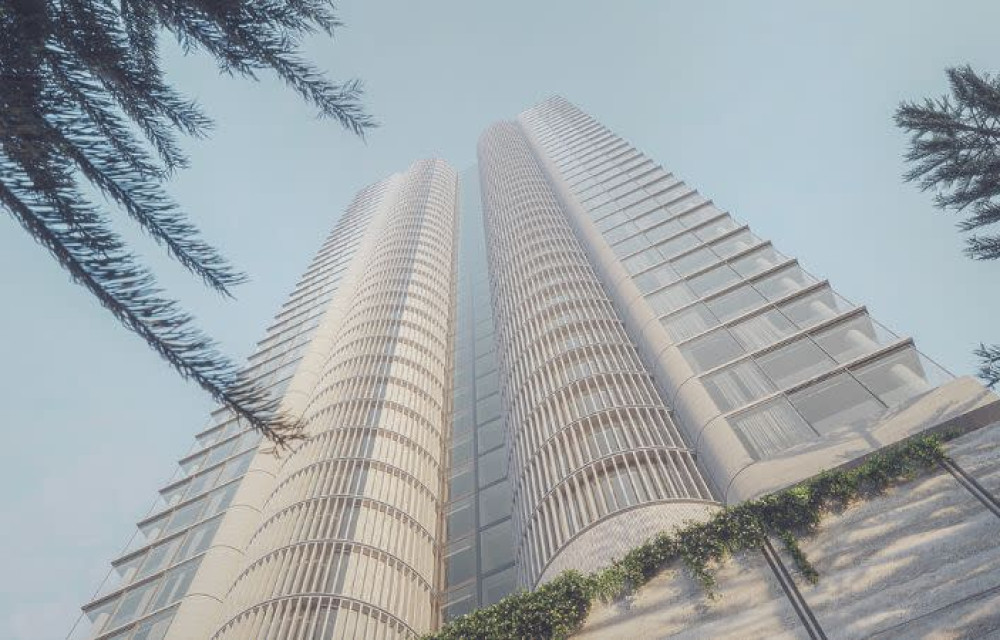 Artist impression of a proposed high-rise residential development on the Gold Coast beachfront showing multiple towers integrated into a coastal urban setting