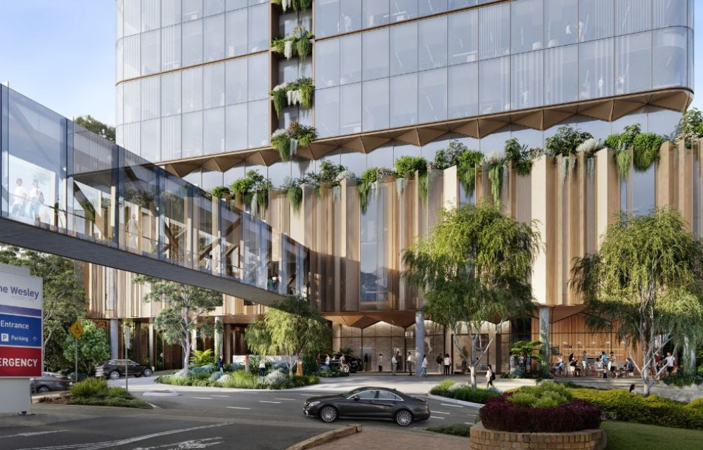 A conceptual rendering of a multi-storey health precinct under development in Brisbane, showing modern architecture, medical facilities, and pedestrian access points near The Wesley Hospital
